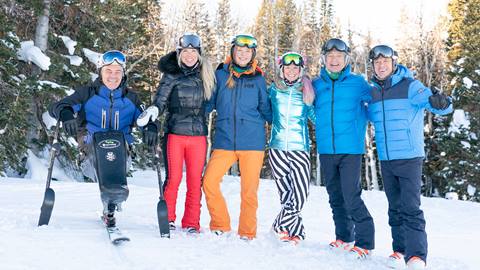 Ski with a Champion Olympians smiling in photo together