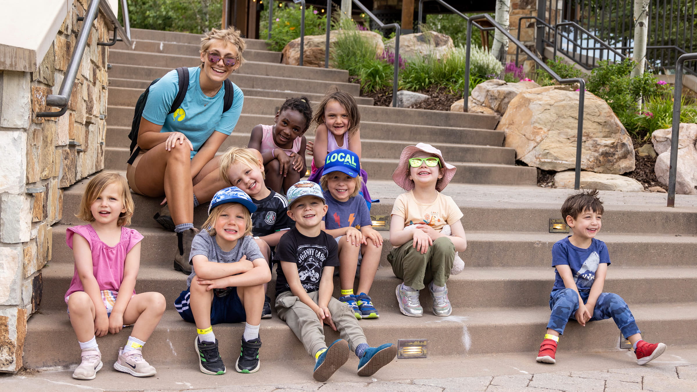 Group of children smiling on stairs