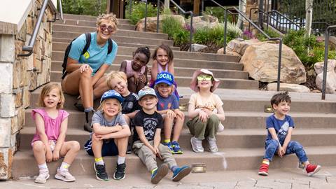 Group of children smiling on stairs