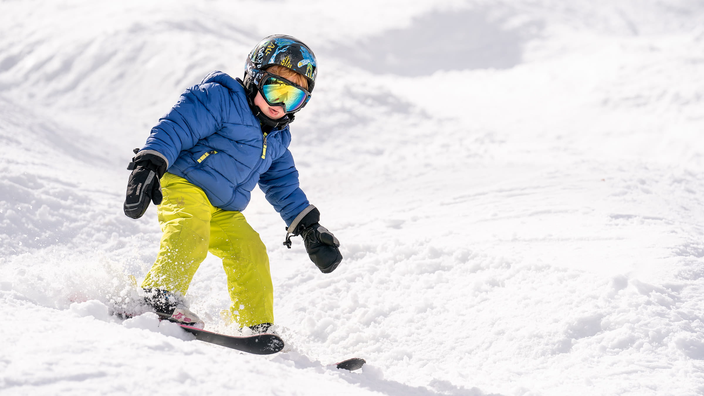 Little boy learning to ski