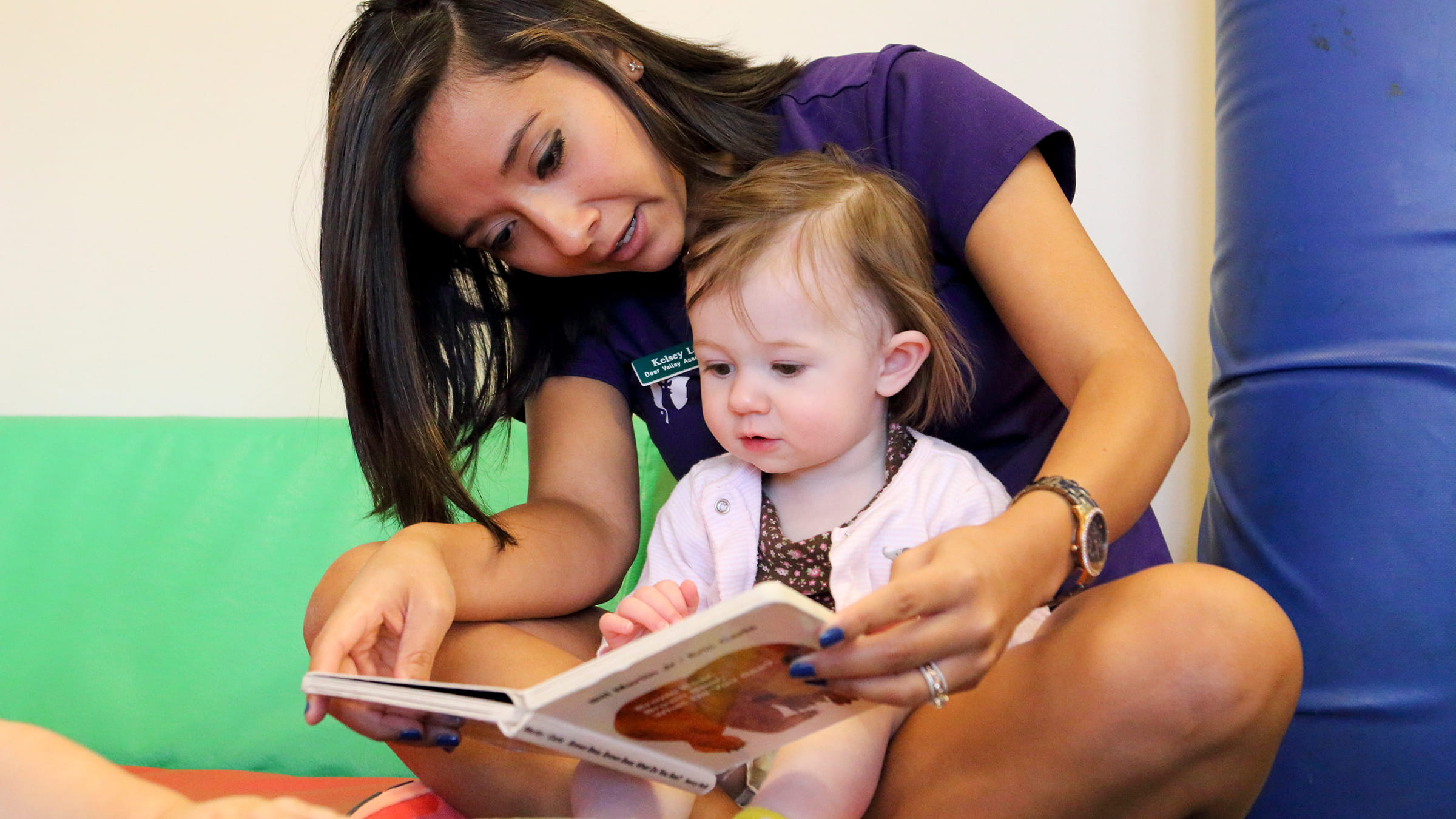 Teacher reading to child.