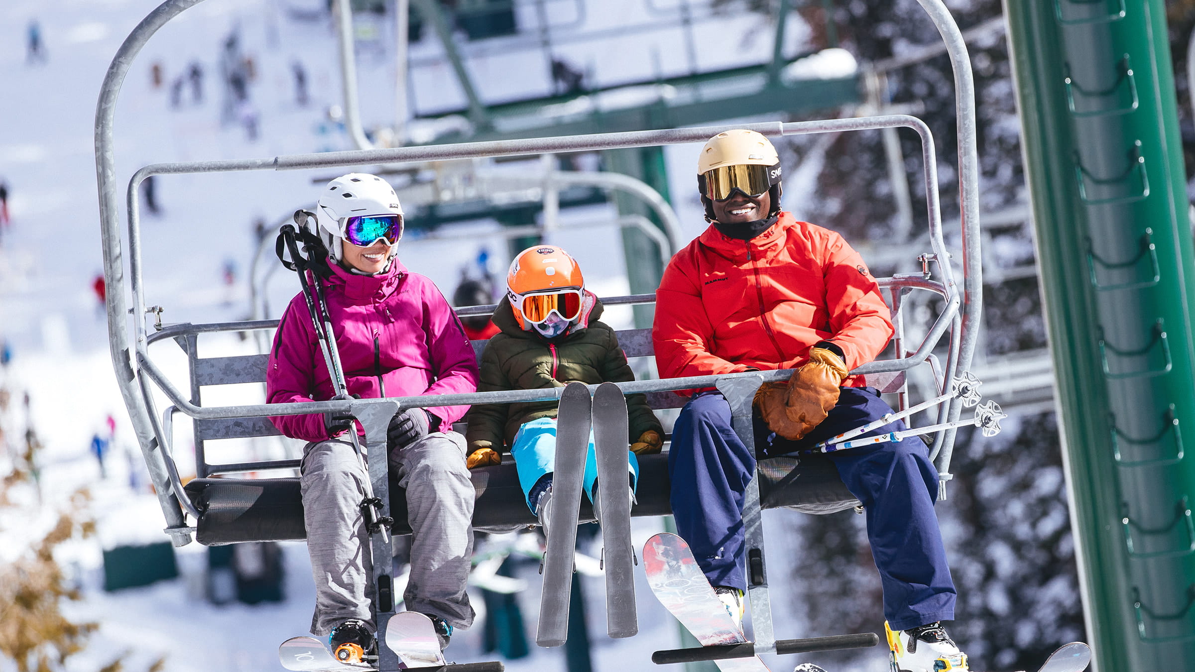 Family riding chairlift together