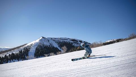 Man skiing groomed run at Deer Valley.