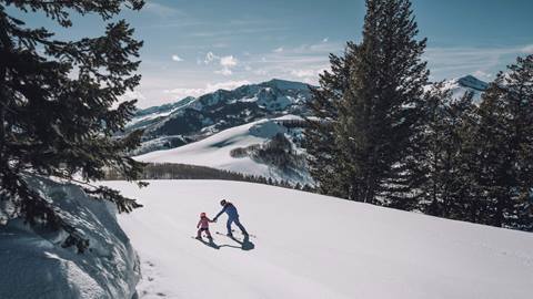 Father and daughter skiing together at Deer Valley in Park City, Utah.