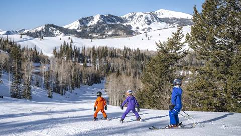 Three kids skiing at Deer Valley.