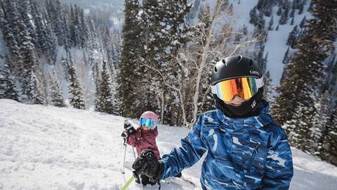 Girl and boy skiing at Deer Valley.