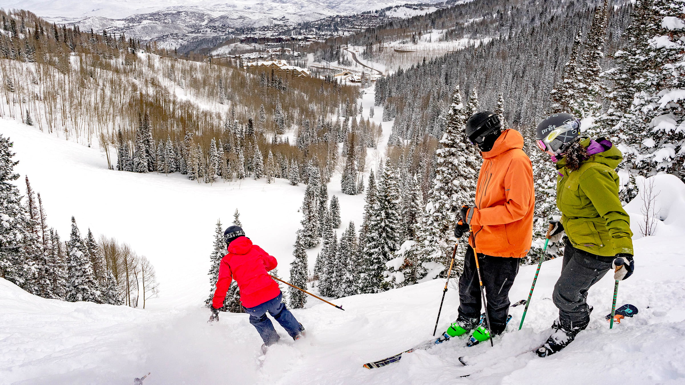 Three friends skiing together at Deer Valley.