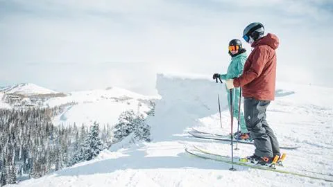 Two guests skiing at Deer Valley Resort.
