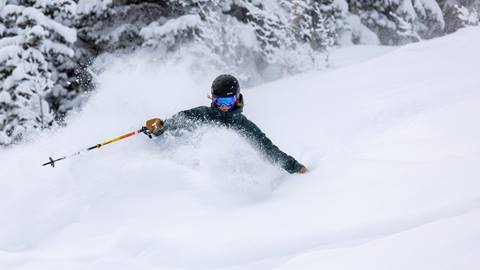 Woman powder skiing at Deer Valley.