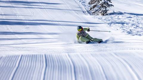 Woman skiing groomed run at Deer Valley Resort.