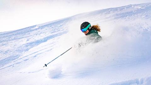 Woman powder skiing at Deer Valley Resort.