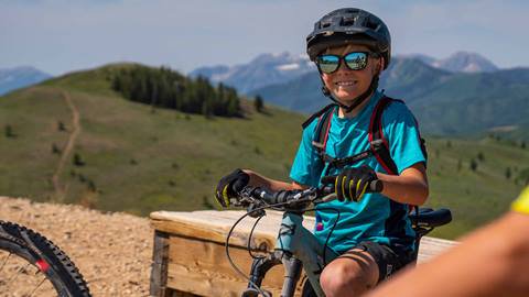 Boy riding mountain bike at Deer Valley.