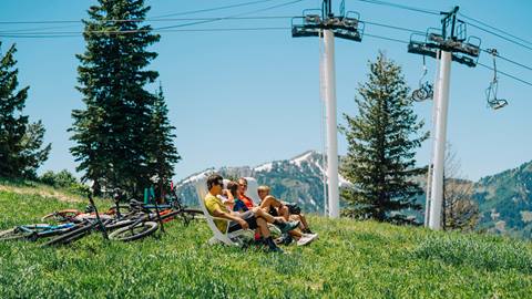 Family sitting at the top of Bald Mountain after mountain biking.