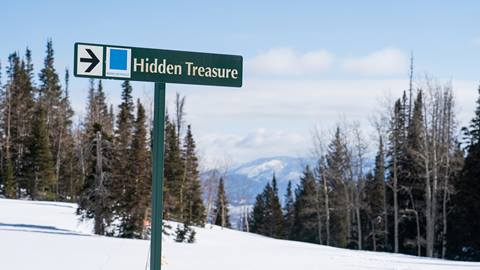 Deer Valley trail sign for Hidden Treasure ski run.