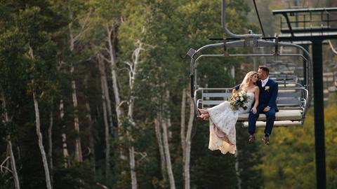 Married couple riding a chairlift at Deer Valley.