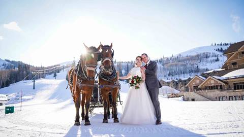 Bride and groom with horses at Empire Canyon Lodge.