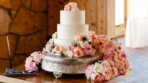 Wedding cake with flowers in Deer Valley's Empire Canyon Lodge