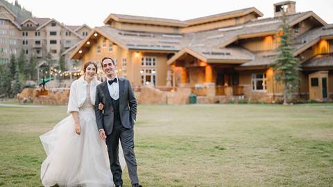 Bride and groom outside Deer Valley's wedding venue Empire Canyon Lodge