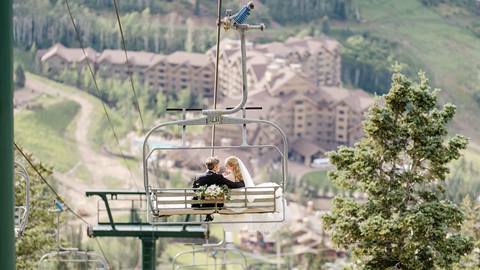 Bride and groom on chairlift at Deer Valley