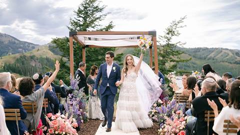 Bride and groom walking down aisle at Cushing's Cabin at Deer Valley