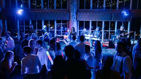 Wedding guests dancing to live band in Silver Lake Lodge at Deer Valley Resort