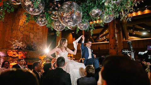 Bride and groom celebrating at wedding reception in Deer Valley's Empire Canyon Lodge