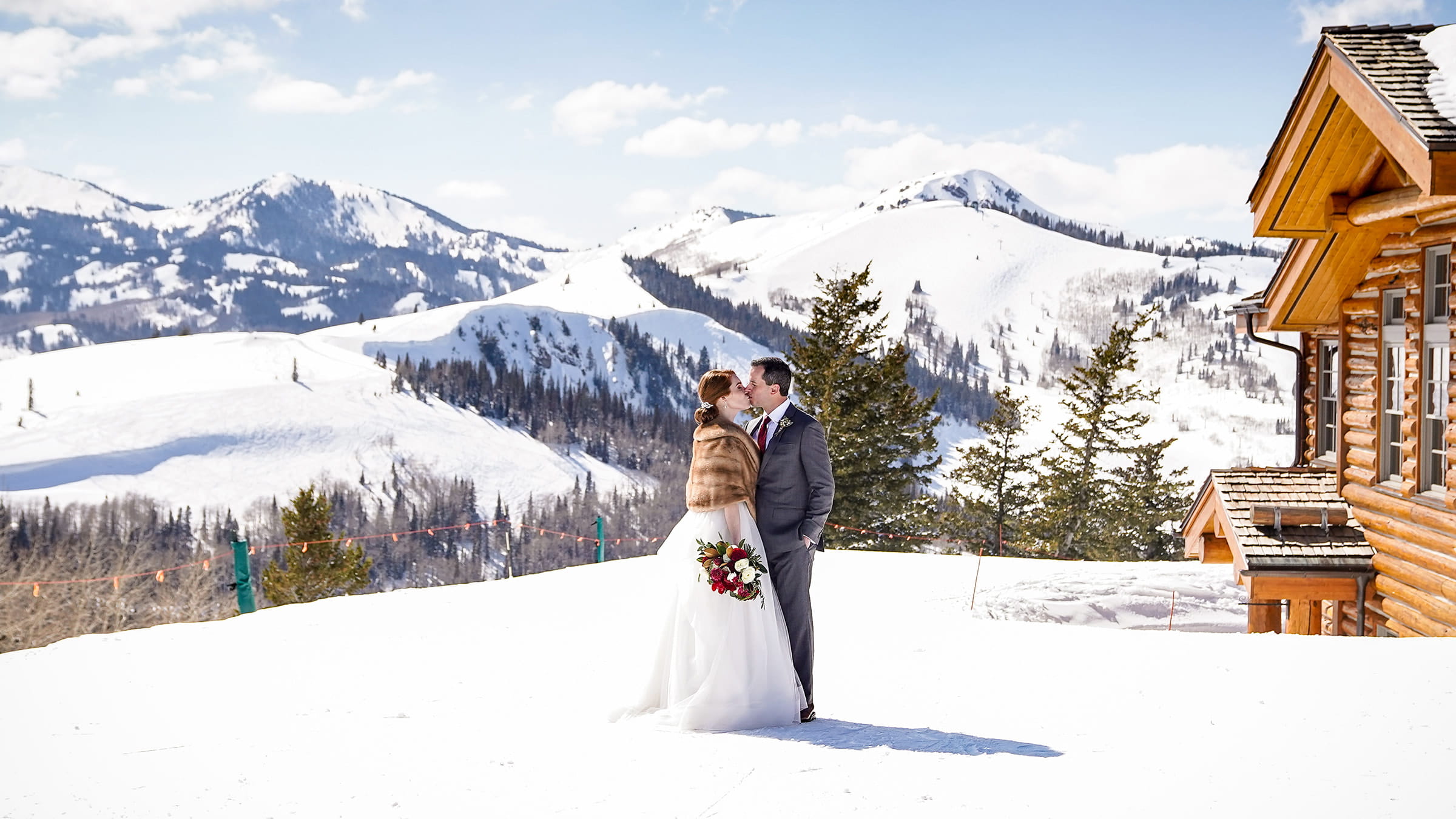 Newly weds kissing at Deer Valley.