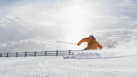 a guest skiing at Deer Valley Resort