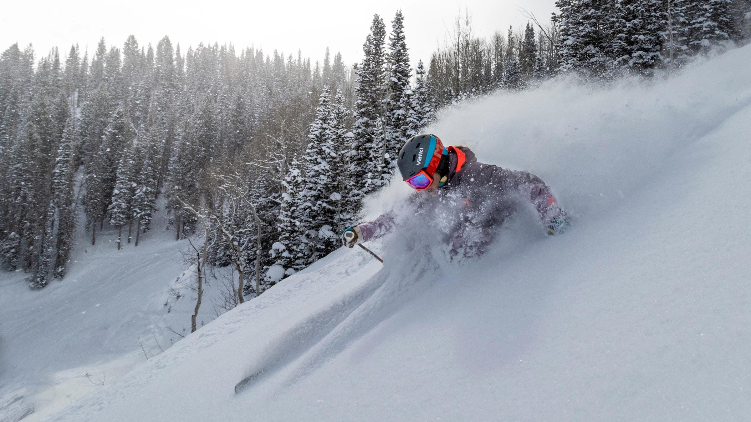 A guest skiing powder at Deer Valley Resort