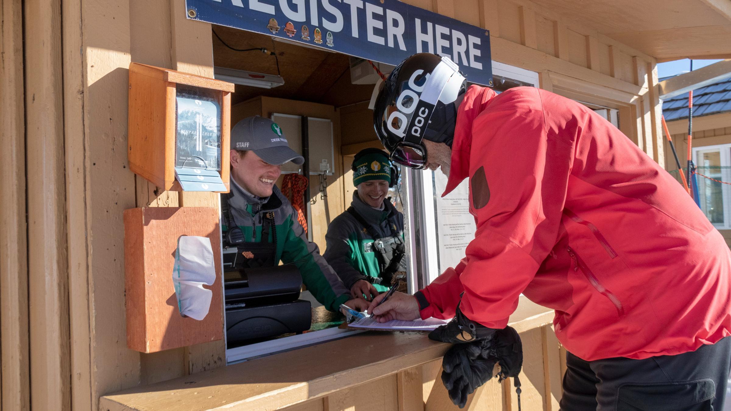 A guest registering at the NASTAR booth