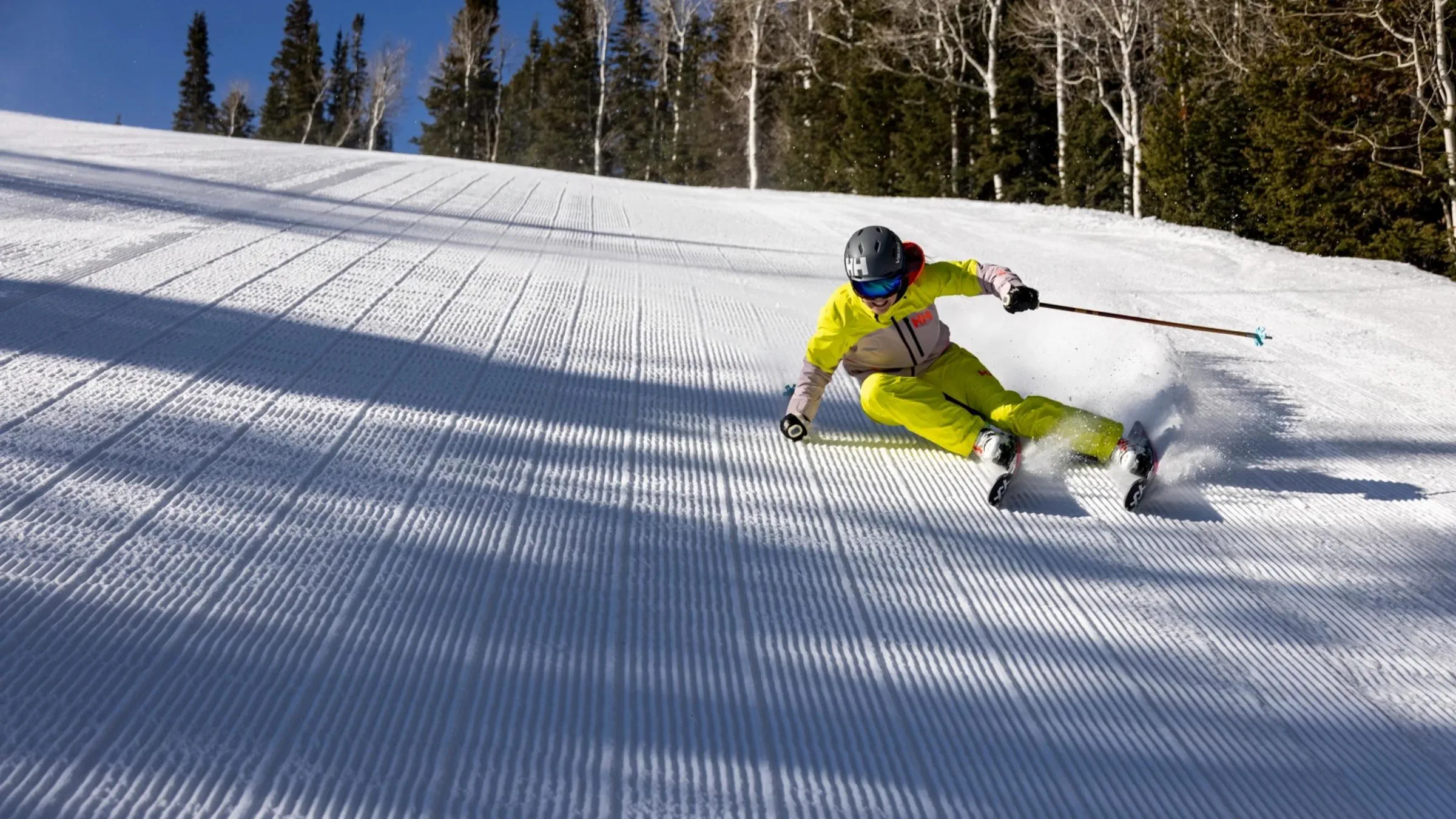A guest skiing powder at Deer Valley Resort