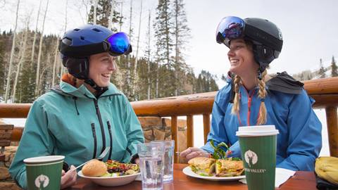 Two guests having lunch on the deck of Empire Canyon Grill