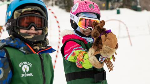 Two kids in ski school smiling and laughing at Deer Valley Resort