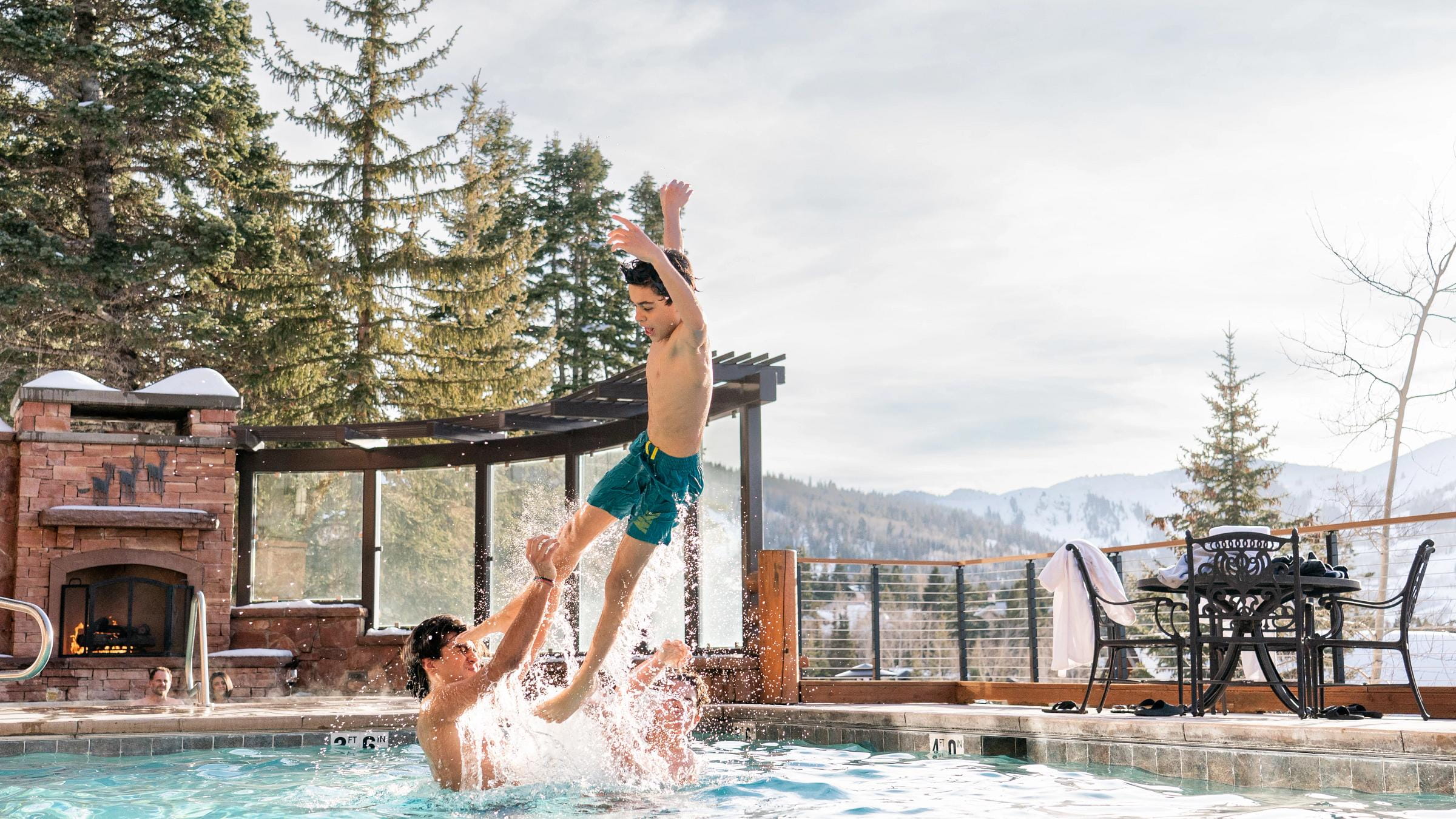 Kids jump in the pool at Deer Valley's Stag Lodge