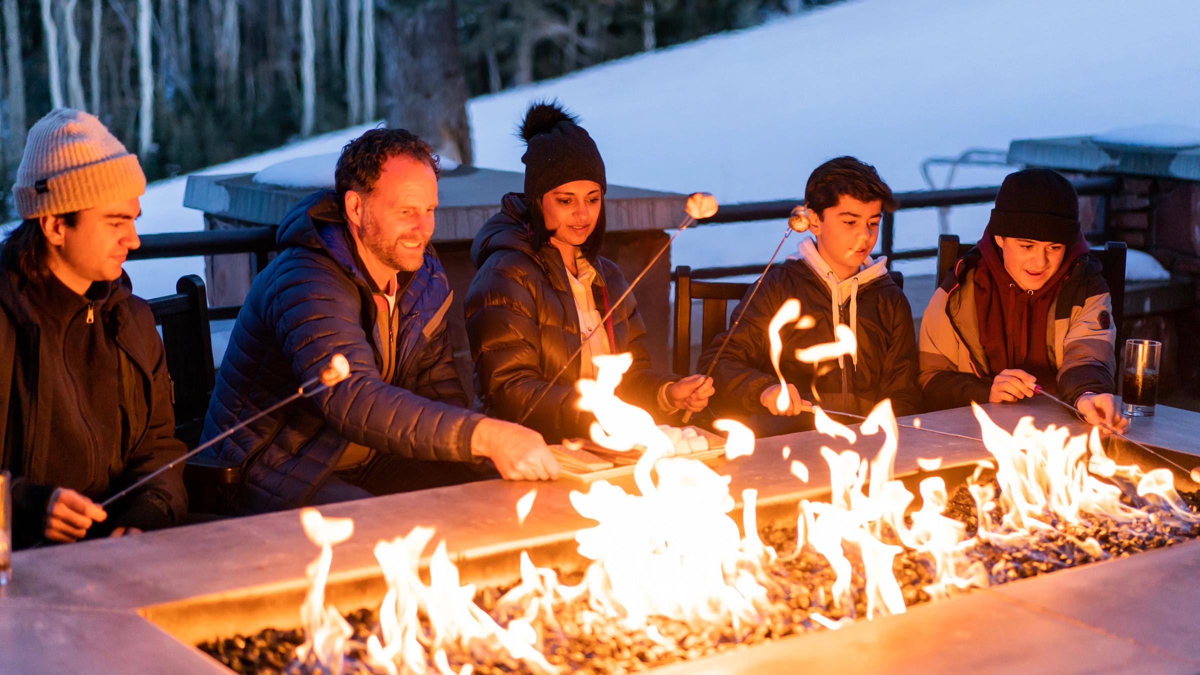 Family enjoying s'mores after skiing Deer Valley in Park City, UT