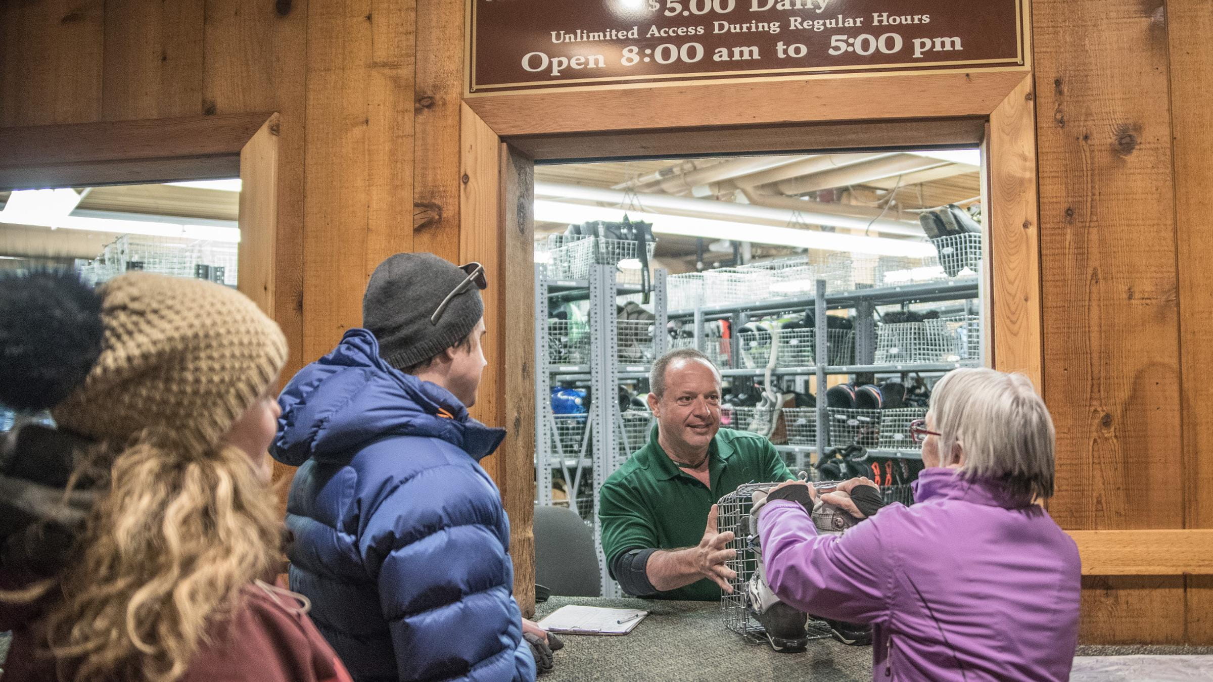 Guests receiving their boots at equipment storage