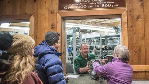 Guests receiving their boots at equipment storage