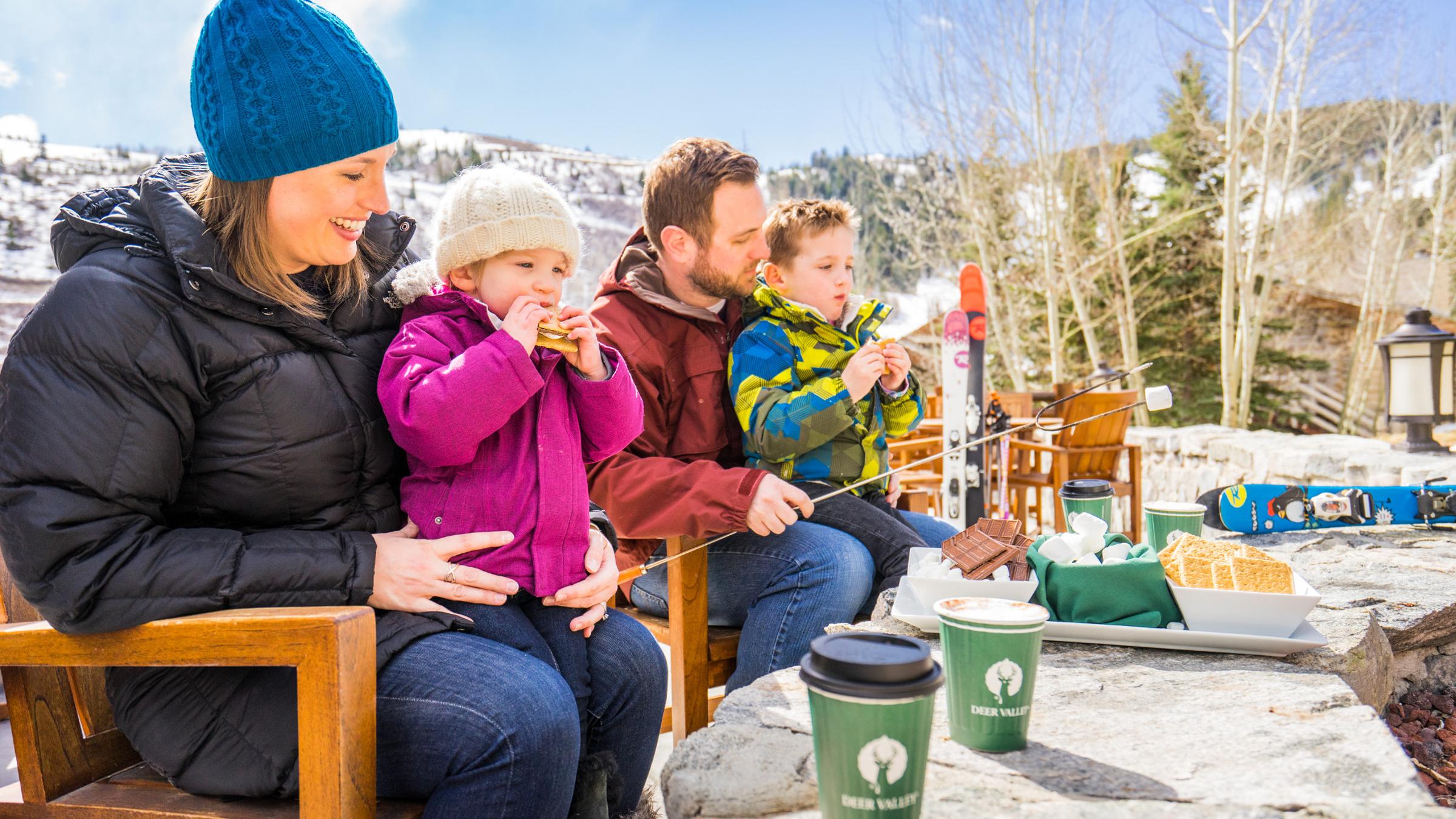 A family having smores at Trails End Lodge