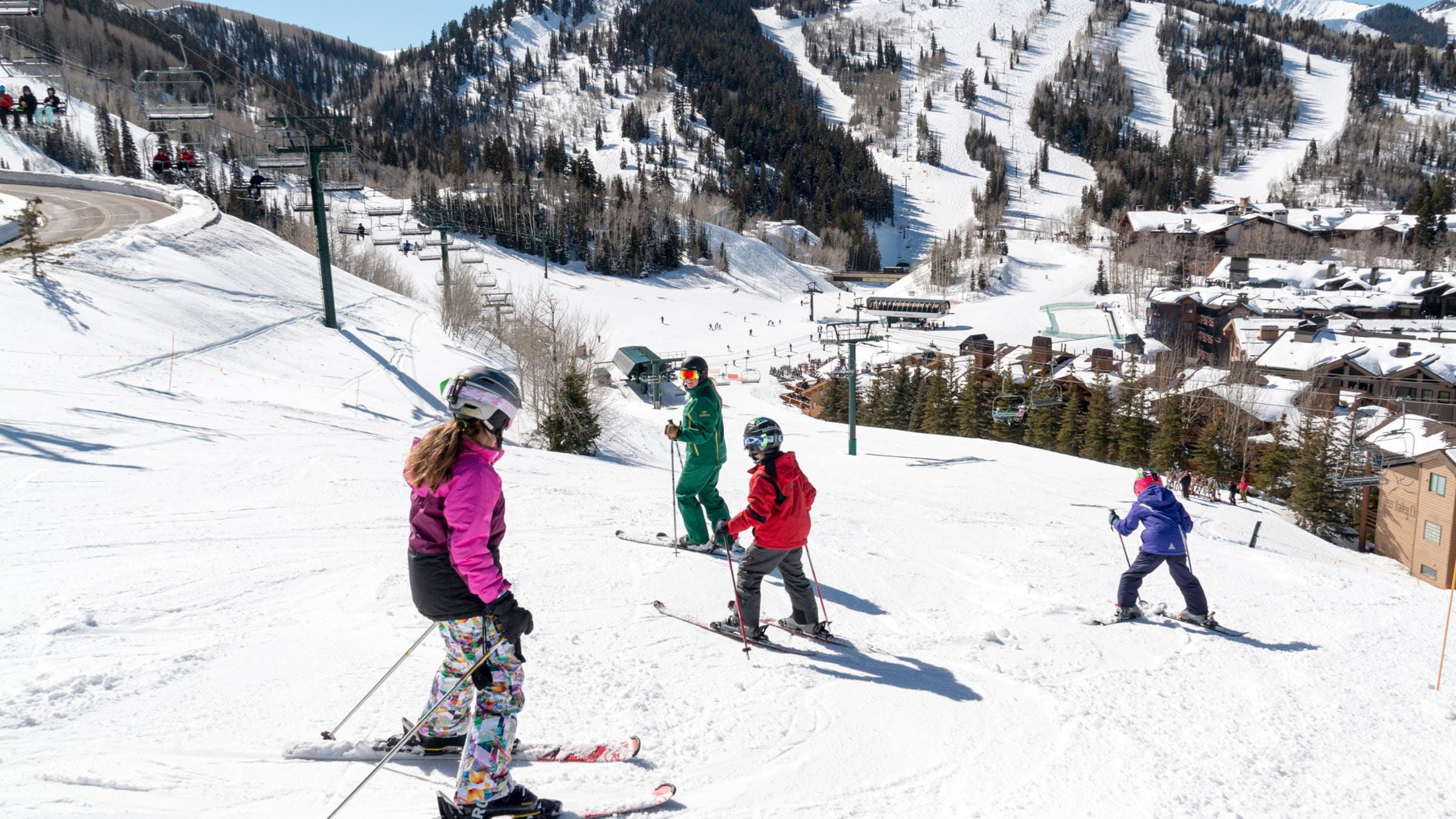 An instructor taking her class down a ski run at Deer Valley Resort
