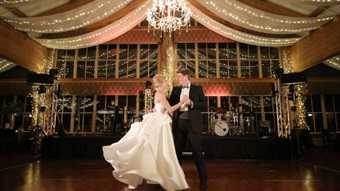 A bride and groom dancing