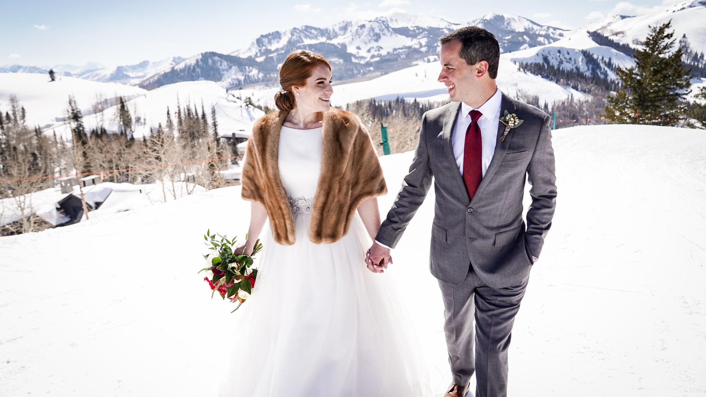 Bride and Groom walking on a snowy mountain at Deer Valley Resort