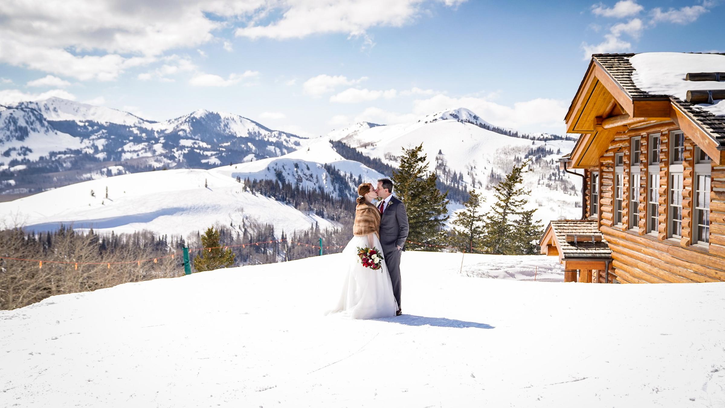 A bride and groom outside of Cushings Cabin