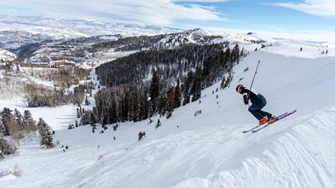 A skier going into the Daly Bowl