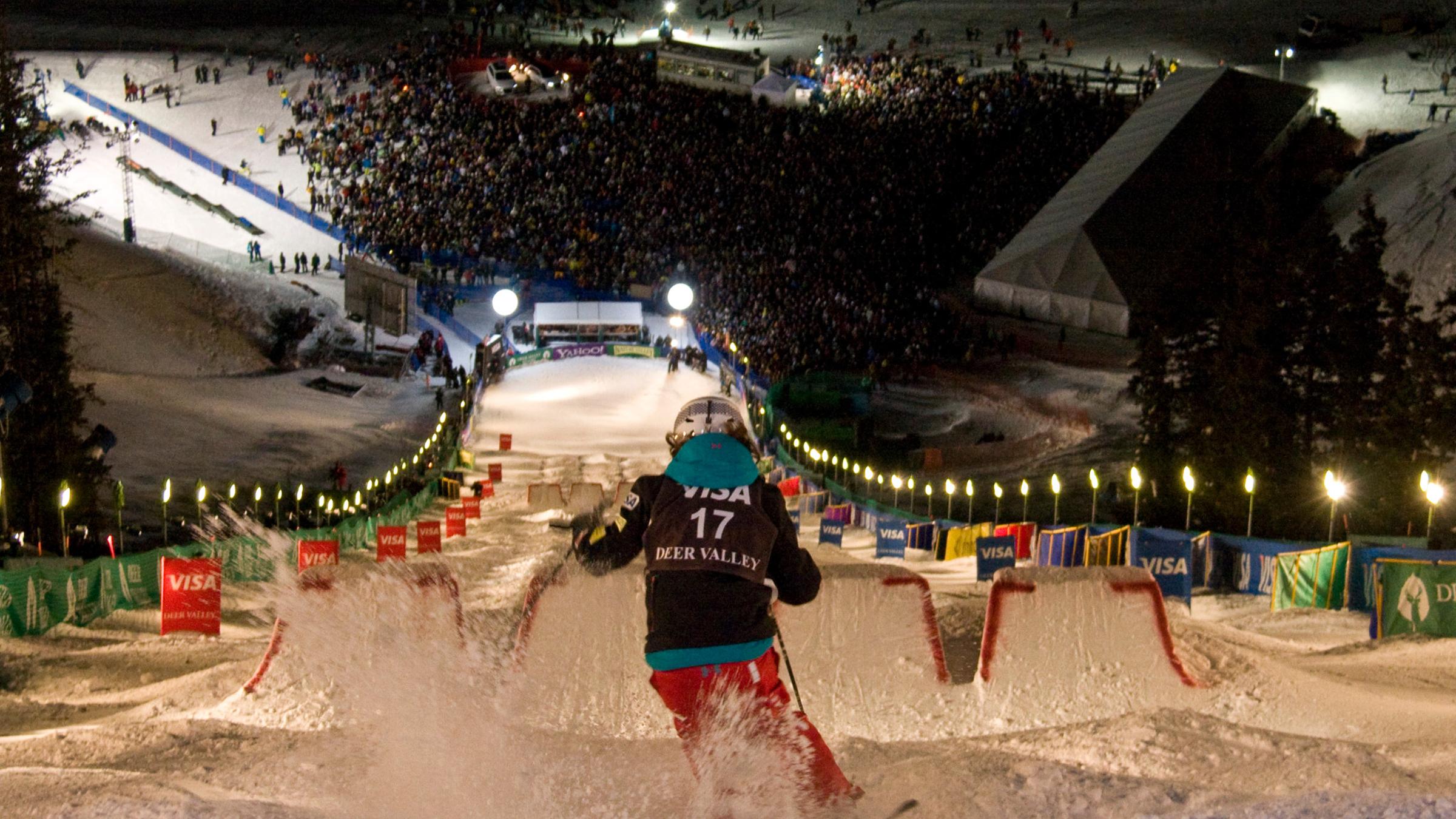 Mogul skier from top of the Champion course, looking down on spectators