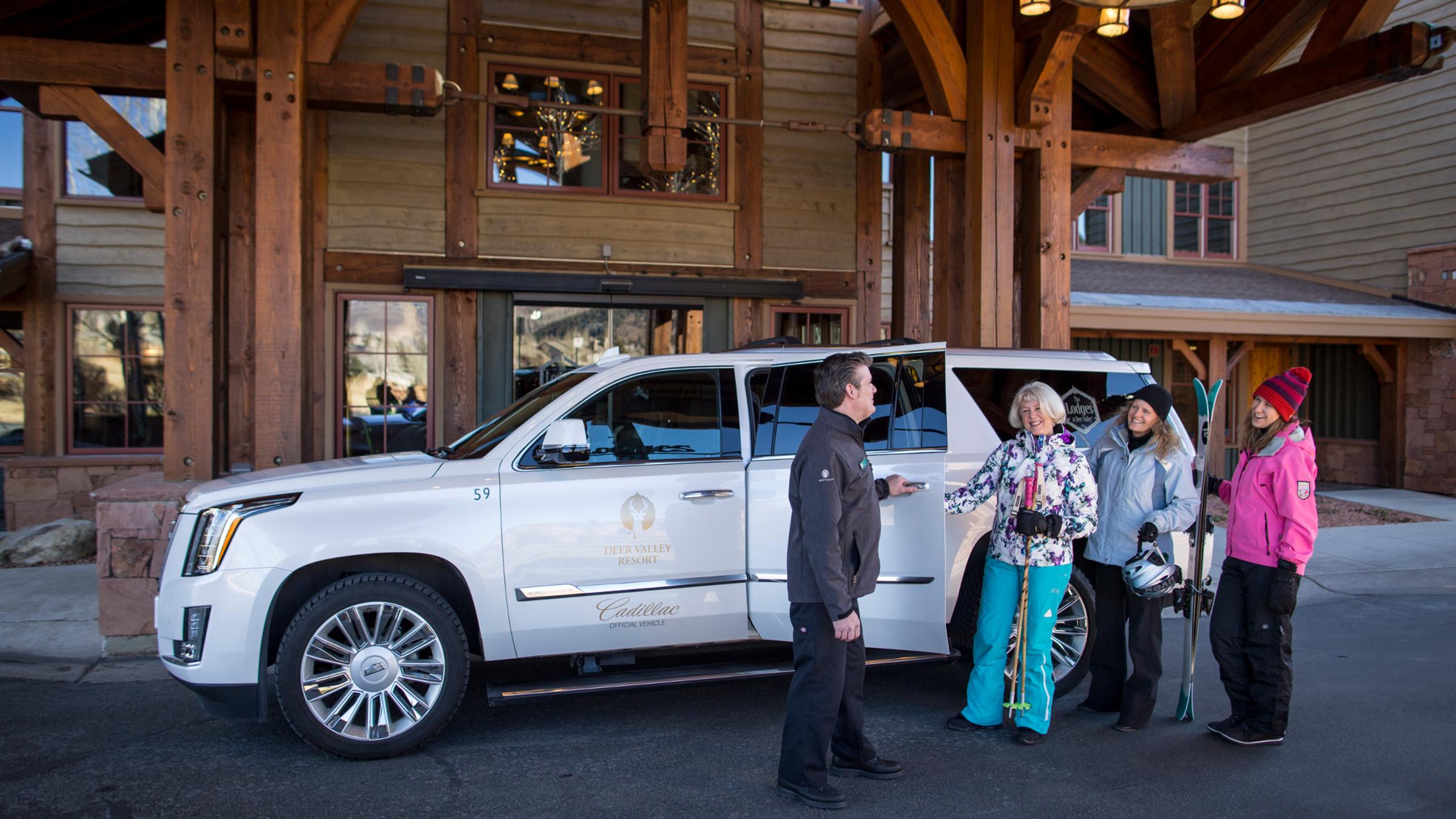 Guests get into their Deer Valley Cadillac