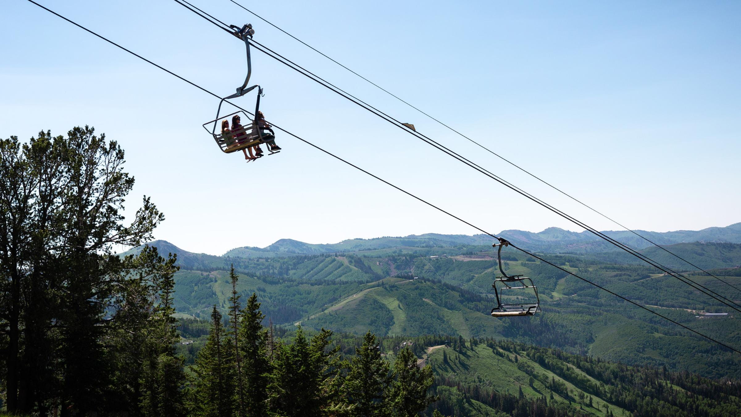 Group of people enjoying the view from the chairlift at Deer Valley
