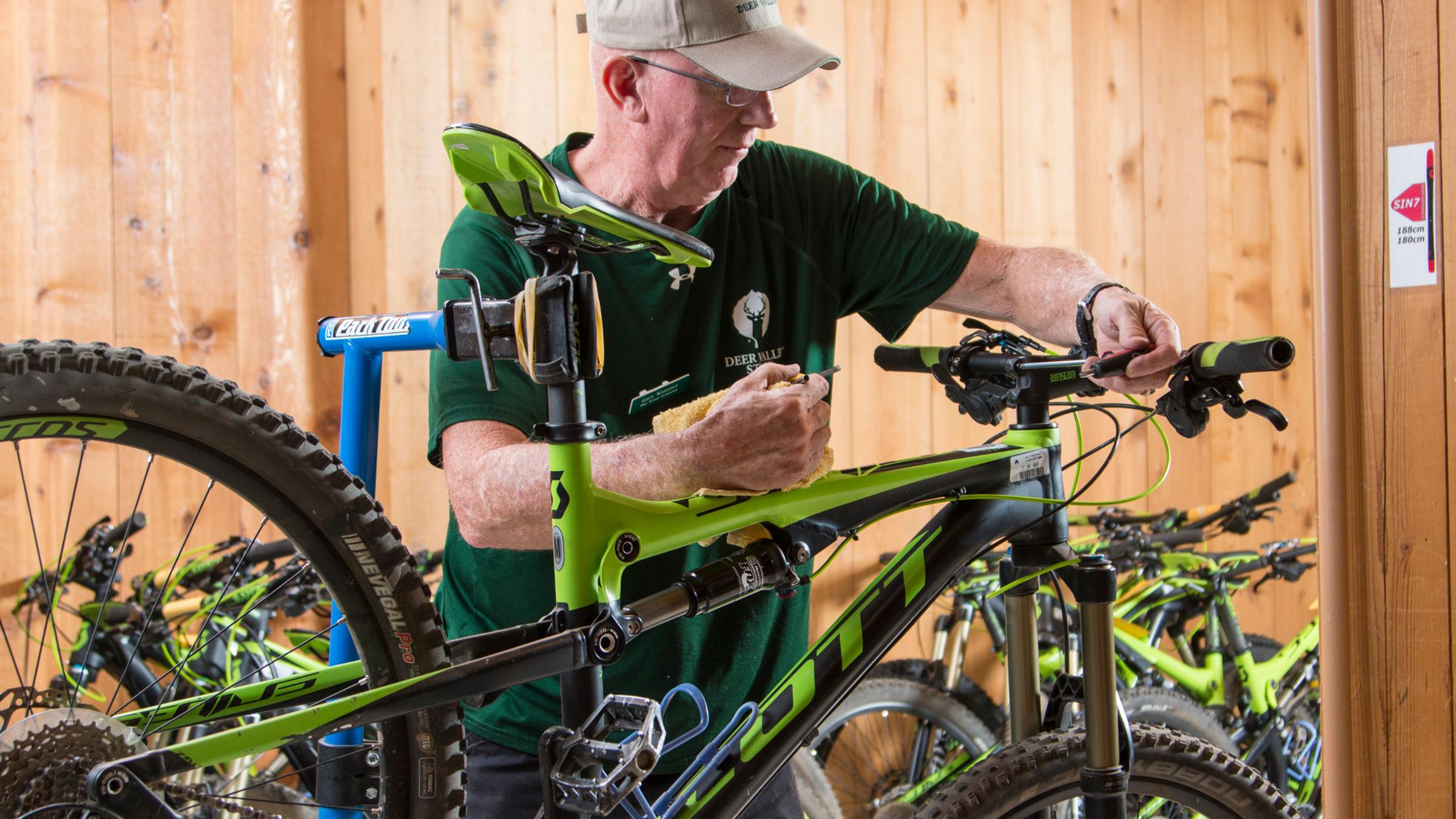 Bike tech inspects a guest's bike at Deer Valley