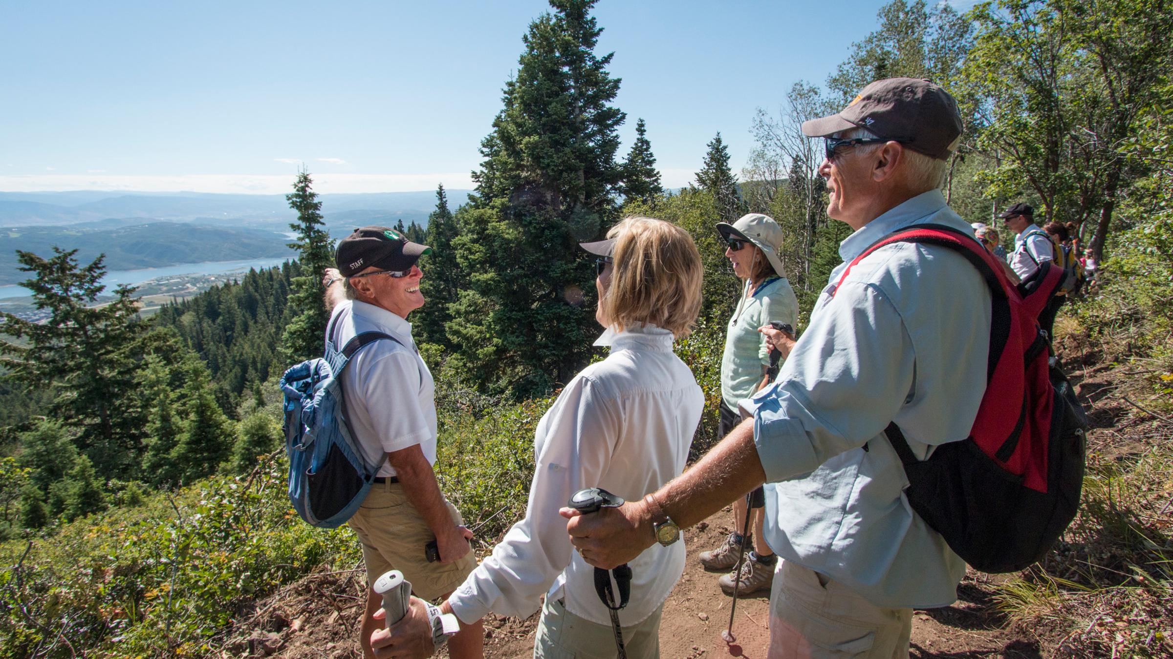 A hiking guide directing a group on a guided hike at Deer Valley Resort