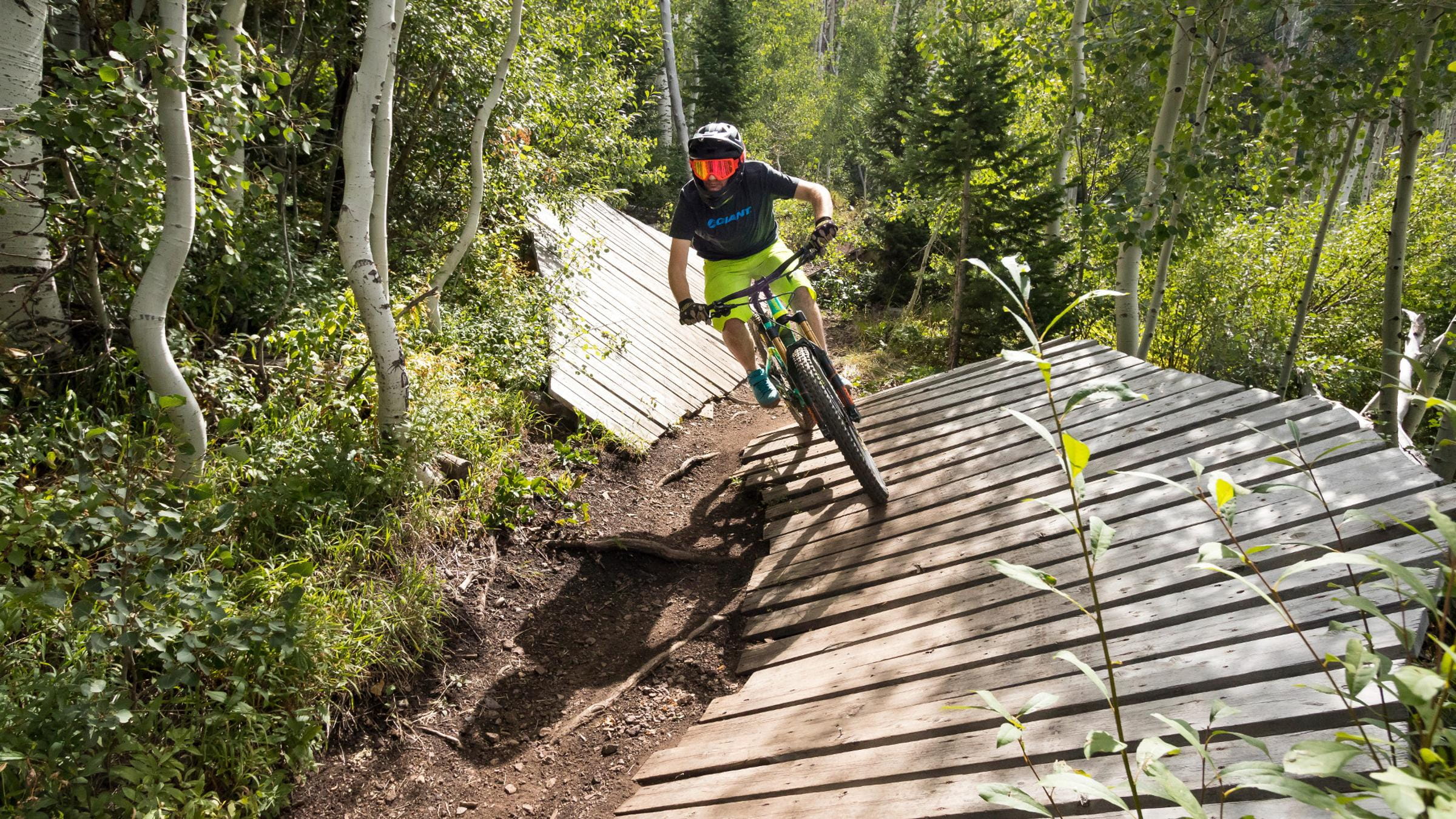 Mountain biker going over a feature