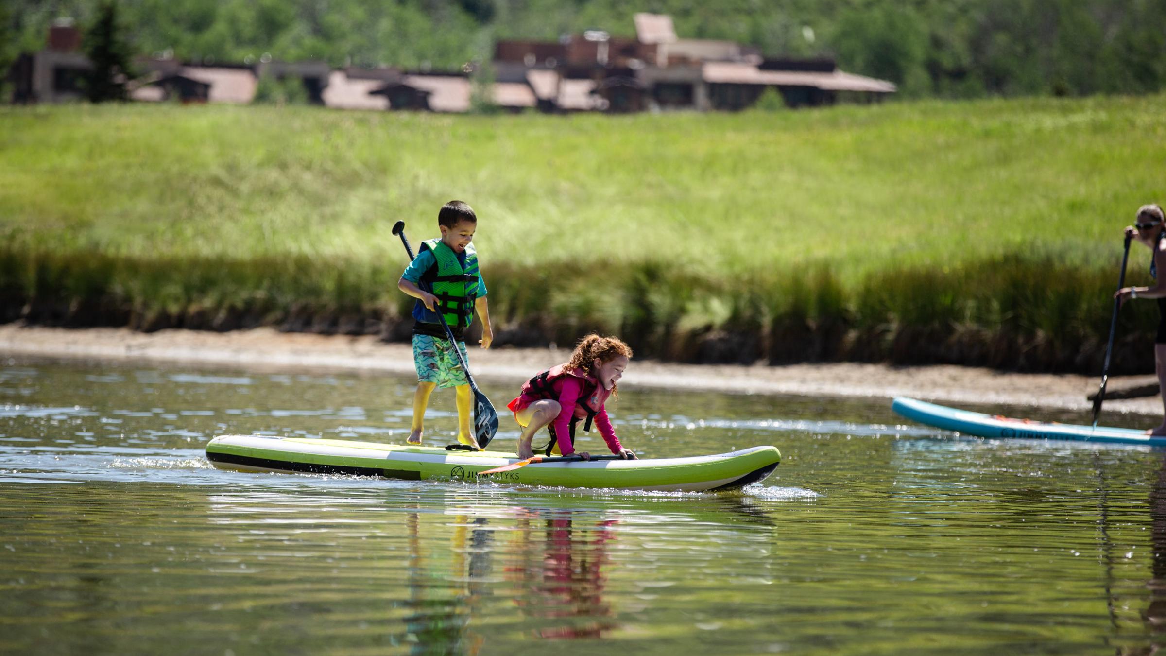 kids on a paddleboard